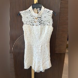 Alexis romper lace open back size small, worn once.